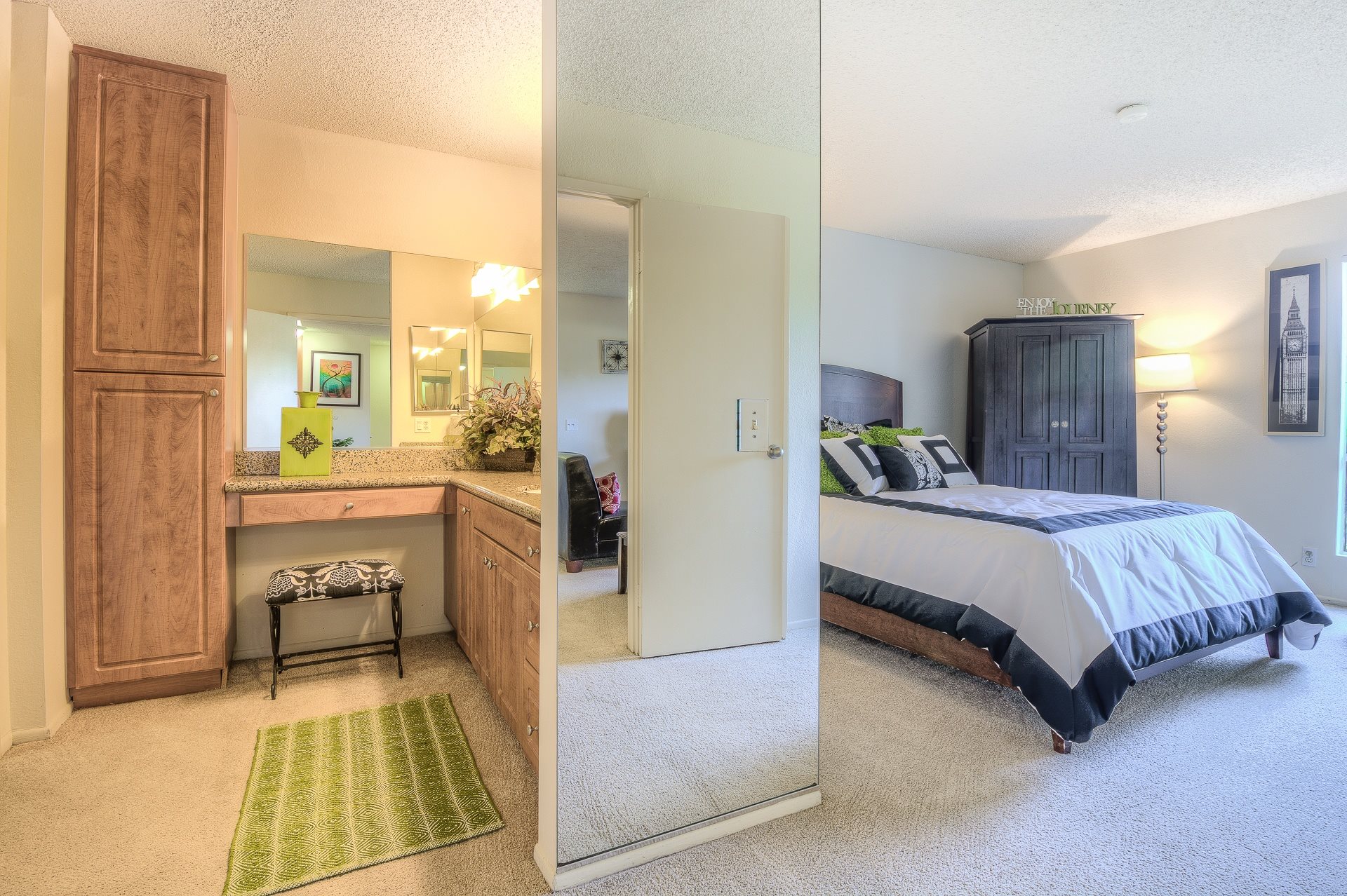 A bedroom with a bed, dresser, and mirror.,A bedroom with a bed, dresser, and mirror.